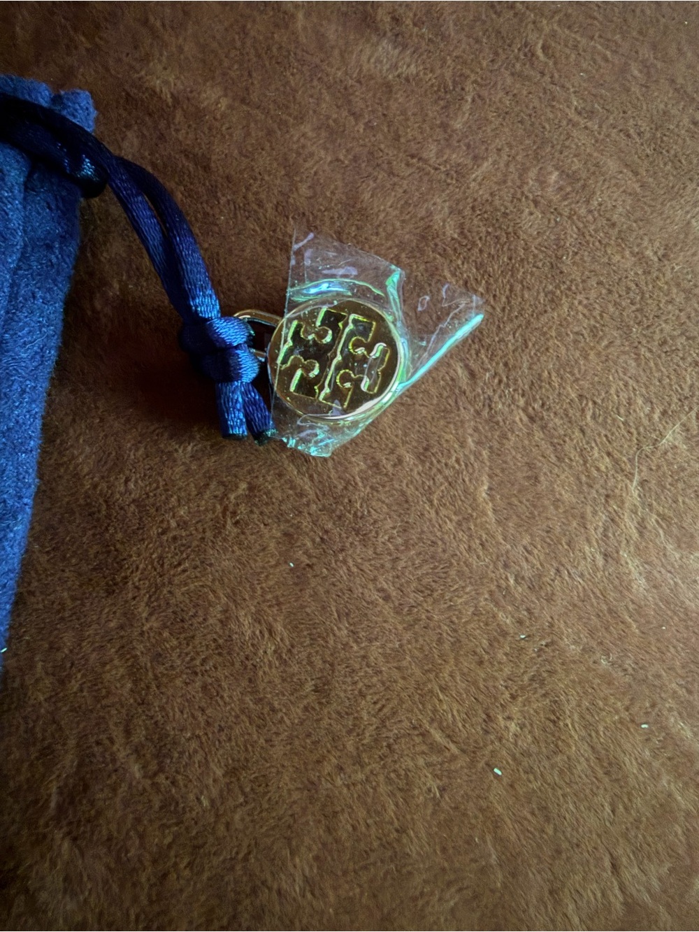 Tory Burch 5*3 Pouch with Gold Logo Charm in original plastic, with Navy Cord
